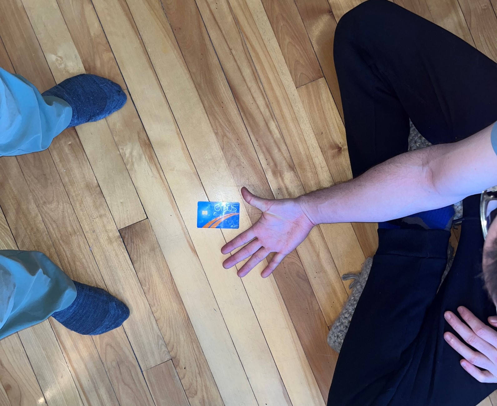 Hand photo on floor with credit card
